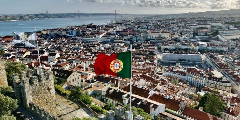 Stunning aerial view of Lisbon cityscape from Saint George's Castle on a sunny day.